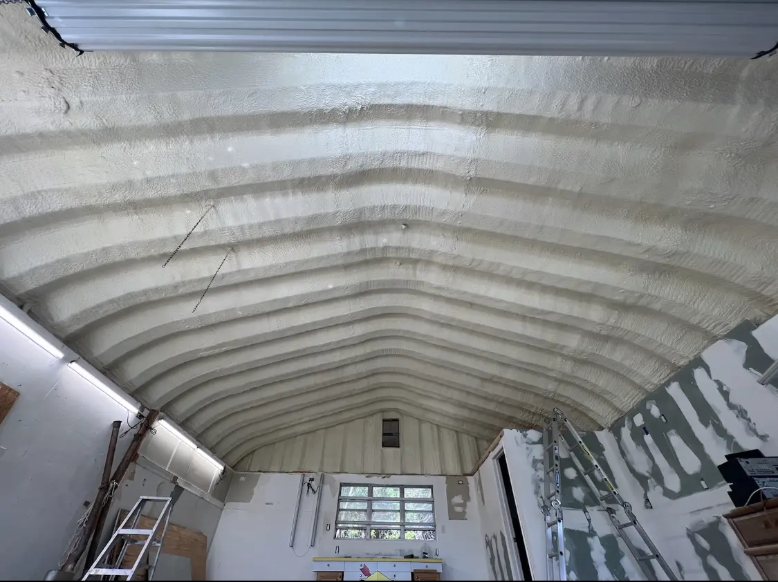 Spray polyurethane foam applied to the underside of a metal roof deck in Murray